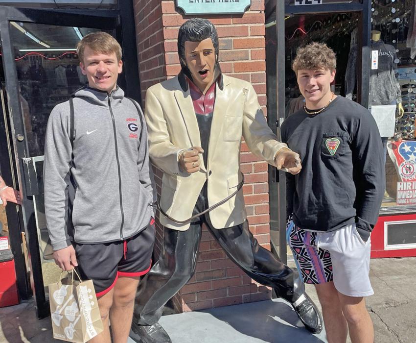 Coy Determan (l) and Carson Klundt (r) rub shoulders withe the King, Elvis Presley.