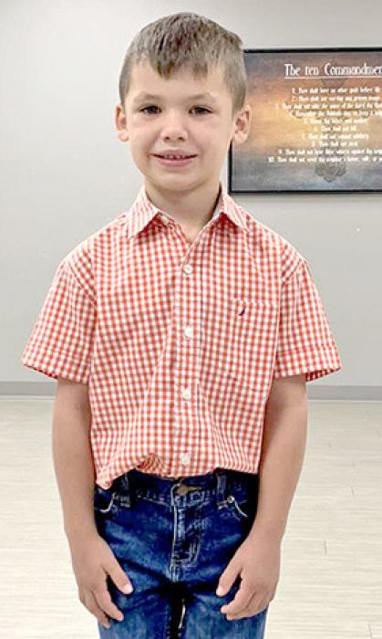 Cloverbud William Schulte models his selected outfit.