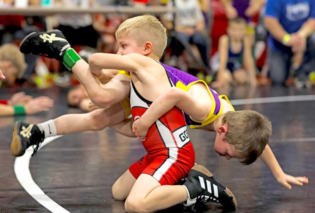 Abe Veskrna manhandles his opponent on his way to a first place.