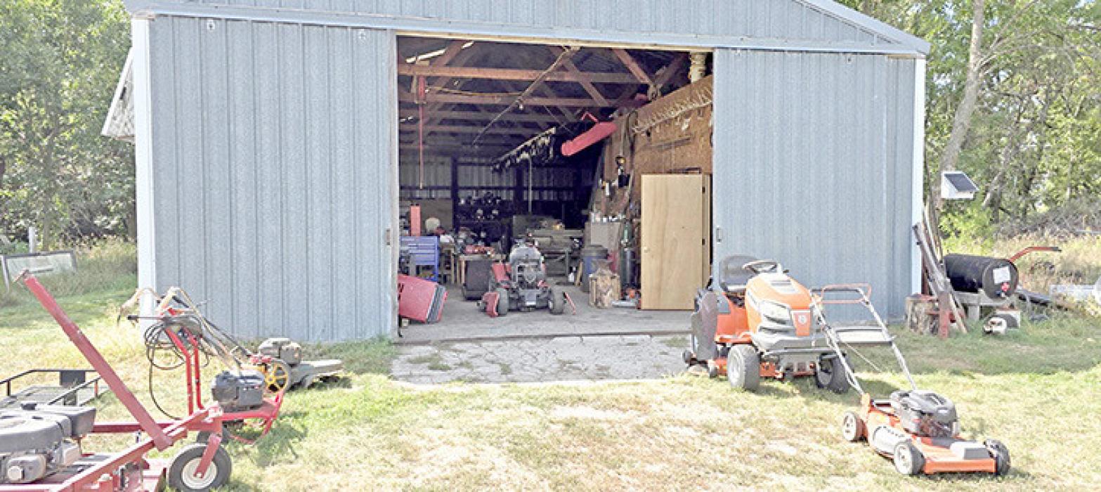 A sample of the kinds of machines Marvin Yoder can work on are shown outside his shop in rural Gregory.