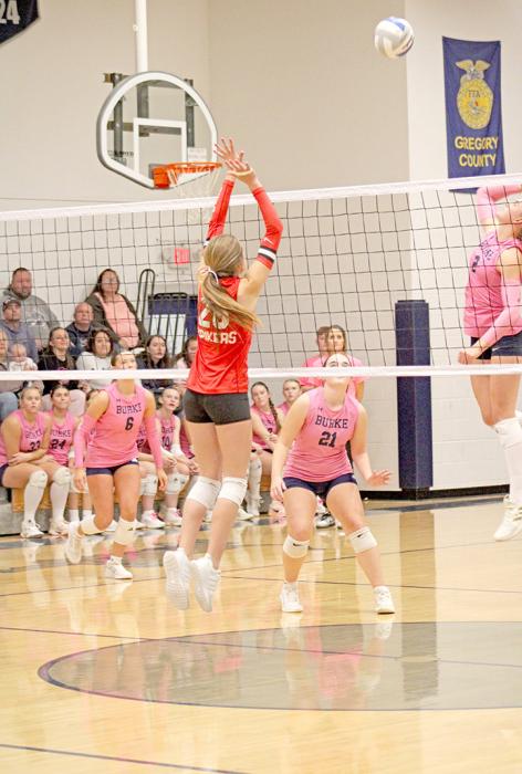 Adelyn Veskrna lines up to block the middle attacker. (Photo by Maya Hull)