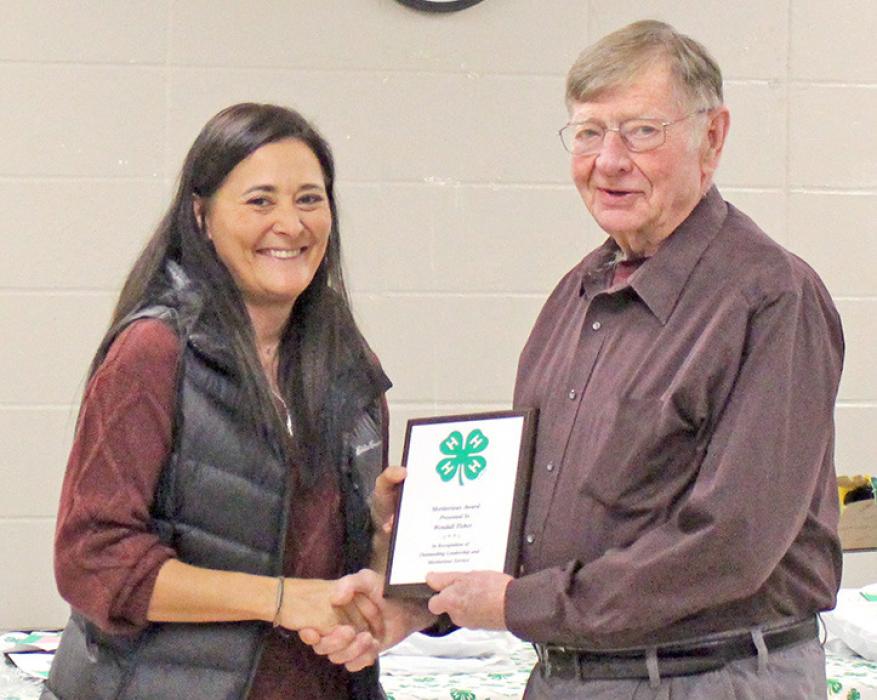 Meritorious Award being prsented to Wendall Tischer.