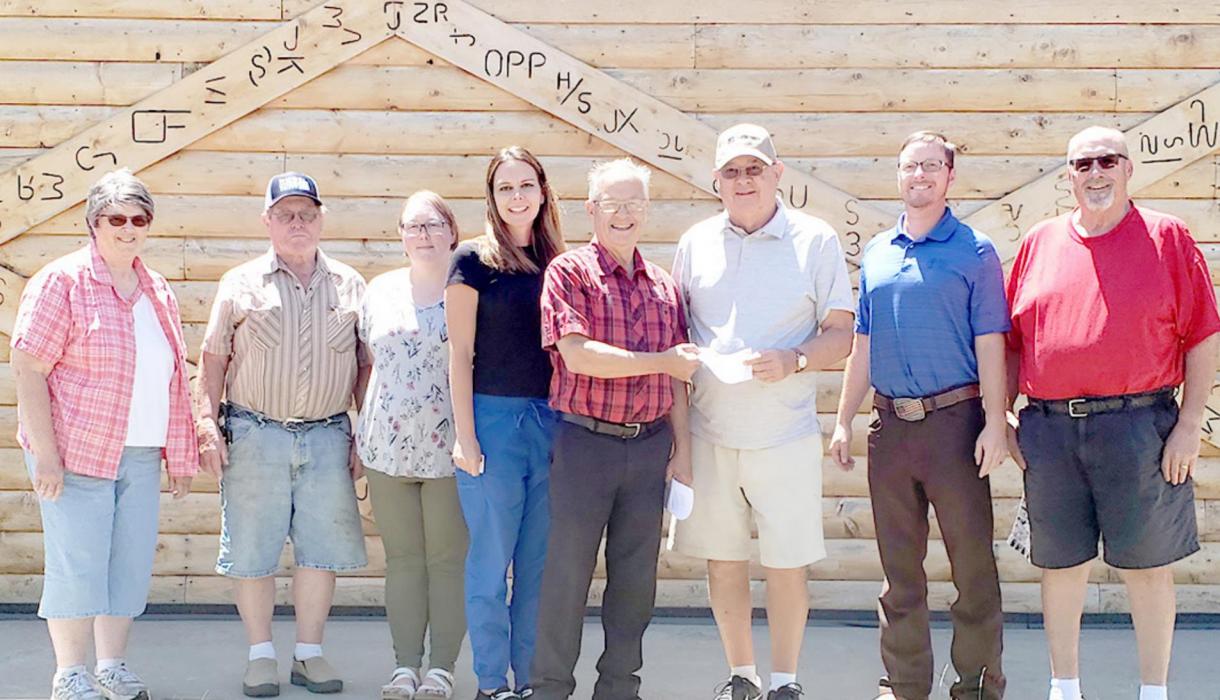 Dr. Marvin Braun, representing the Horizons group, accepts a check from Ron Kyburz, representing the Gregory Community Foundation, for the storage shed/chair project at the Park Performance Center in Gregory. Other members of the Horizons group are l to r: Bev Rubel, Richard Rubel, Ashley Lozano, Jenny Braun, Dr. Marvin Braun, Ron Kyburz, Hank Wonnenberg and Gregg Drees.