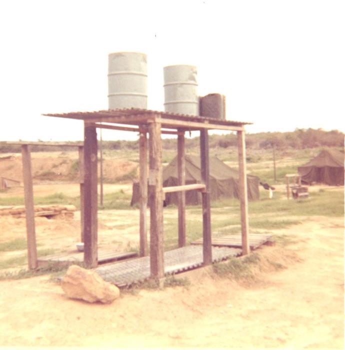 The showers at camp consisted of 55-gallon barrels on a platform. The water was warmed by the sun during the day and was cold by night - if any water was left.
