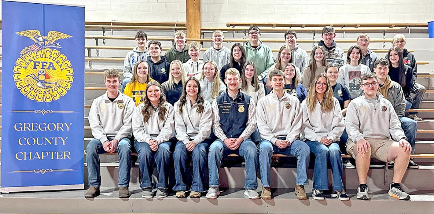 National FFA President Thad Bergschneider, center, is shown here with Gregory County FFA members during the FFA’s Meal on Main fundraiser, held Sunday, February 16, to kick off National FFA week. Bergschneider visited with attendees and then spoke about the importance of FFA. (Photo by Mollie Andrews)
