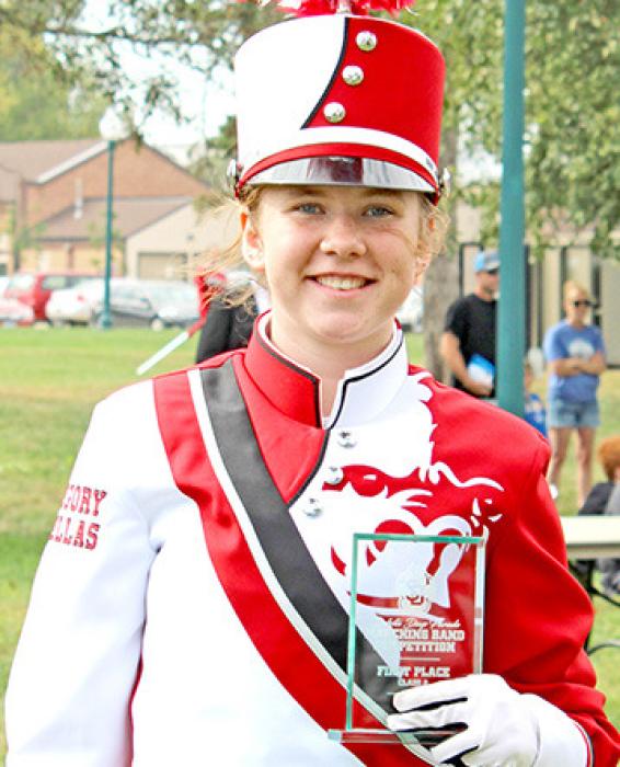 Drum Major Dani Timanus accepted the first place plaque on behalf of the Marching Gorillas at the University of South Dakota D Days parade in Vermillion. (Photos by Sara Anderson)