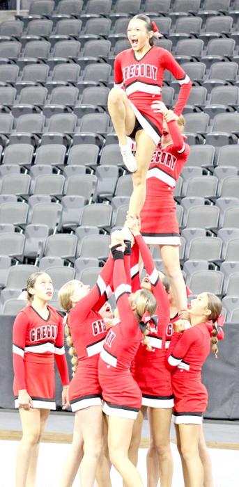 Audience members thought the competitive cheer team performed a flawless routine, but a controversial decision by a safety judge docked them ten points. (Photo by Sara Anderson)
