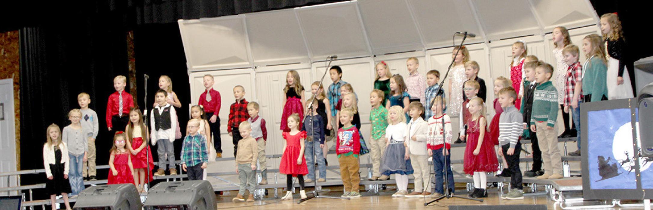 The begindergarten and kindergarten classes sang This Holiday and If I Were a Reindeer.
