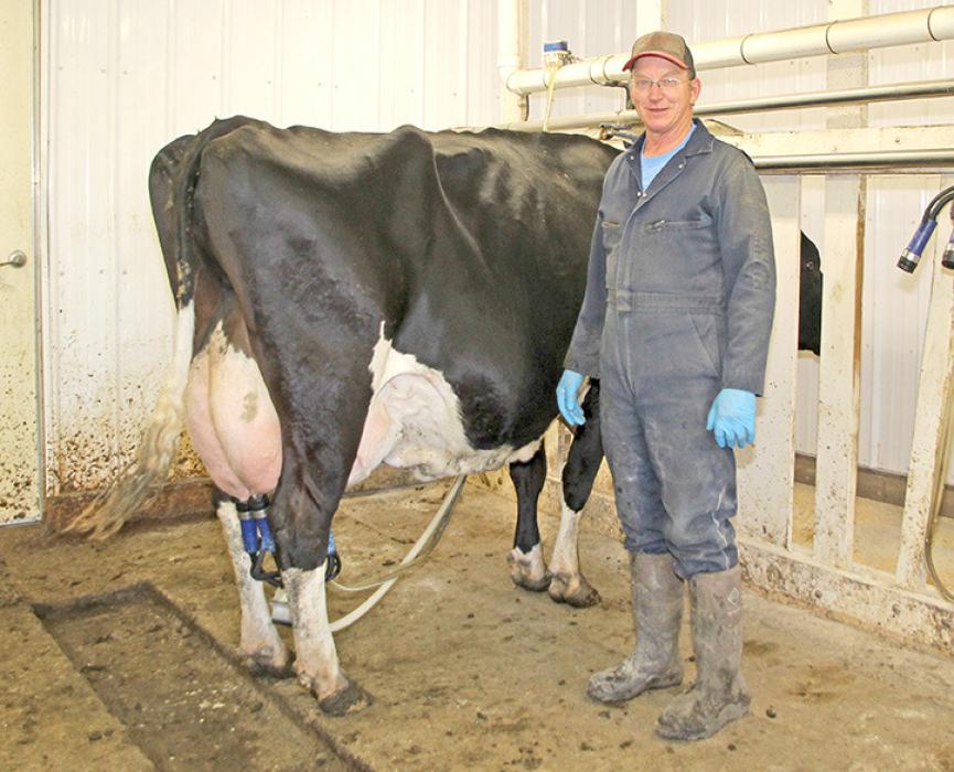 Verlyn and Dana Jons stand in their stanchion barn on April 22 on their dairy near St. Charles, SD. They are the last dairy in Gregory County. (Photo by MLPhotography)