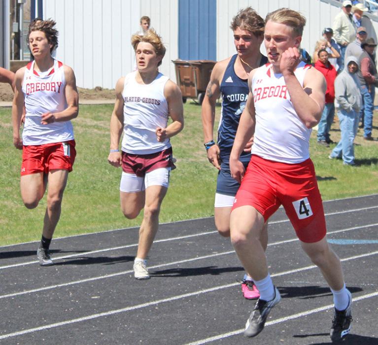 Noah Bearshield, far left, and Paul Sinclair, far right, are shown here in the 100 meter dash. (Photo by Gracie Stephens)