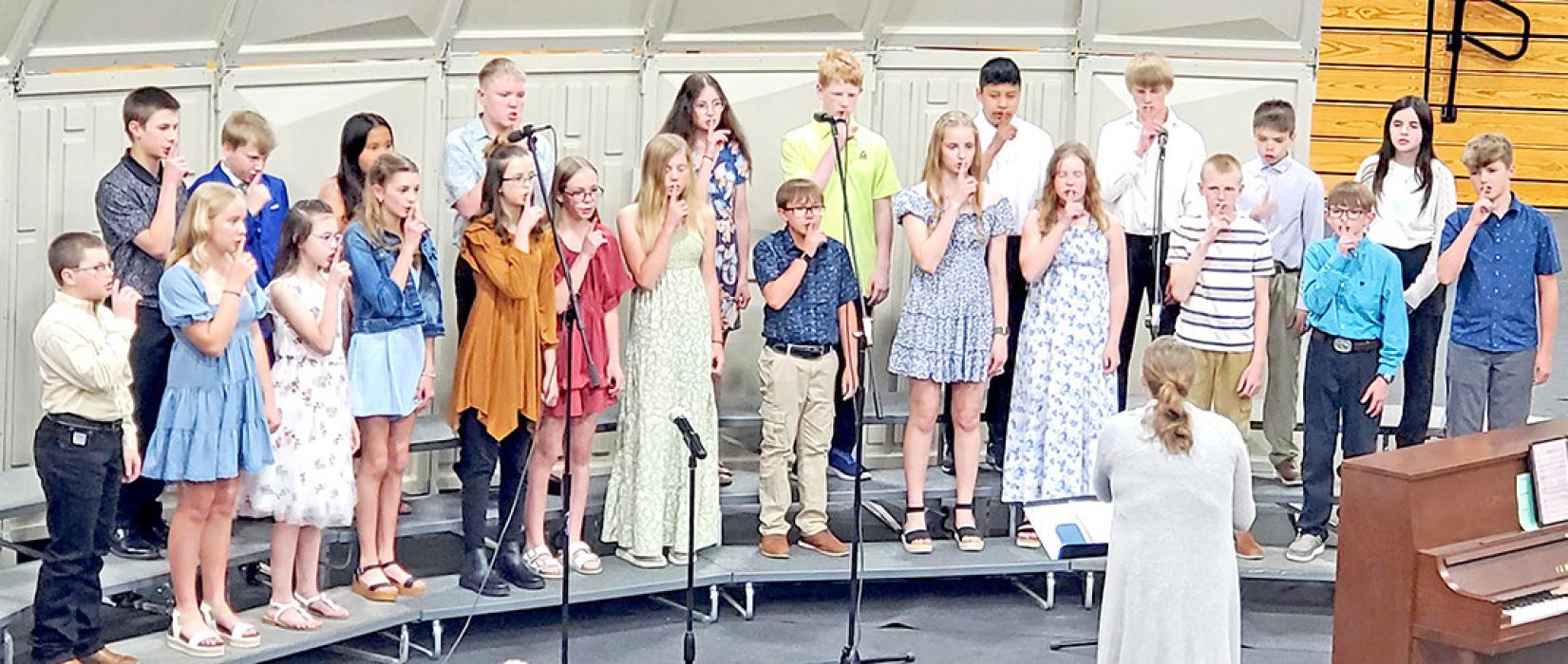 The sixth grade choir kicked off the evening’s performance on Monday, April 28, 2025, with three selections. Thula Klizeo had them clapping and sshh-ing during different parts.