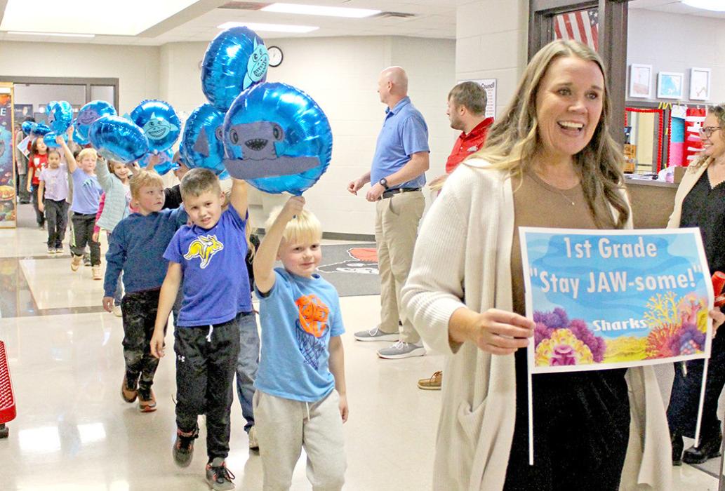 The first grade class had bright blue shark balloons.