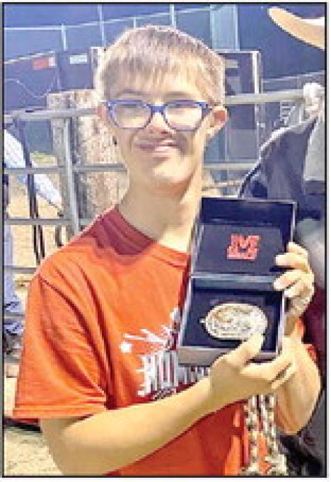 Kayden Fischer was the recipient of the most spirited award. This buckle was donated by Jake Stukel.