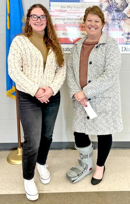 A successful IOOF Winter Formal, spearheaded by Gregory High School student Gabby Jung, raised enough money to gift $250 to four GHS students’ family members who are faced with medical problems. In this photo, Jung is shown awarding a check to Renee Thomas.