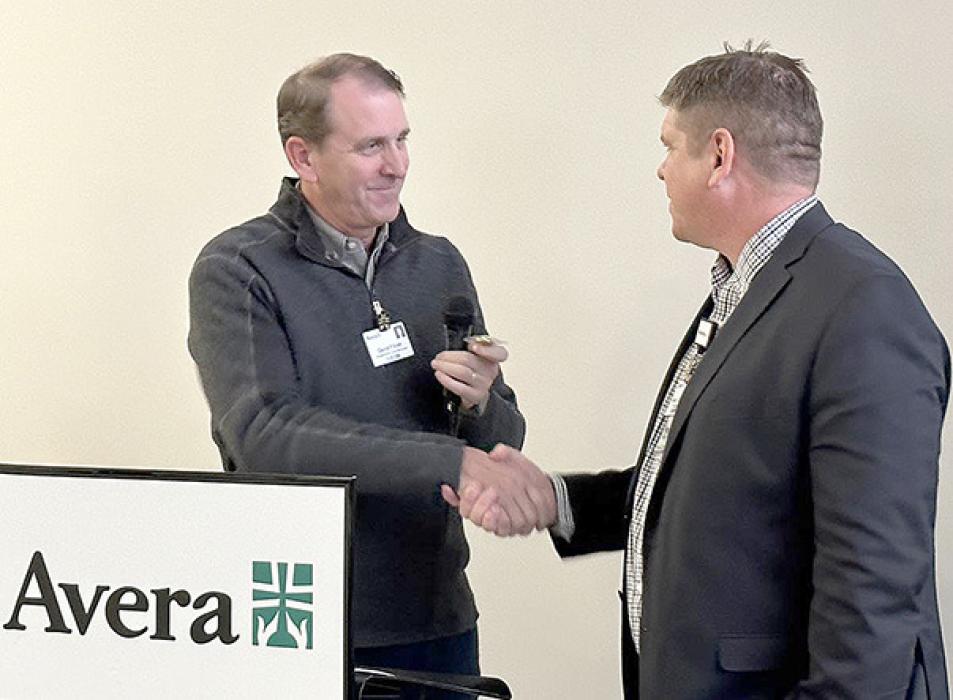Dave Flicek, president and CEO of Avera McKennan Hospital and University Health Center, presented Timanus with an Avera veteran’s pin to recognize his service to the country.