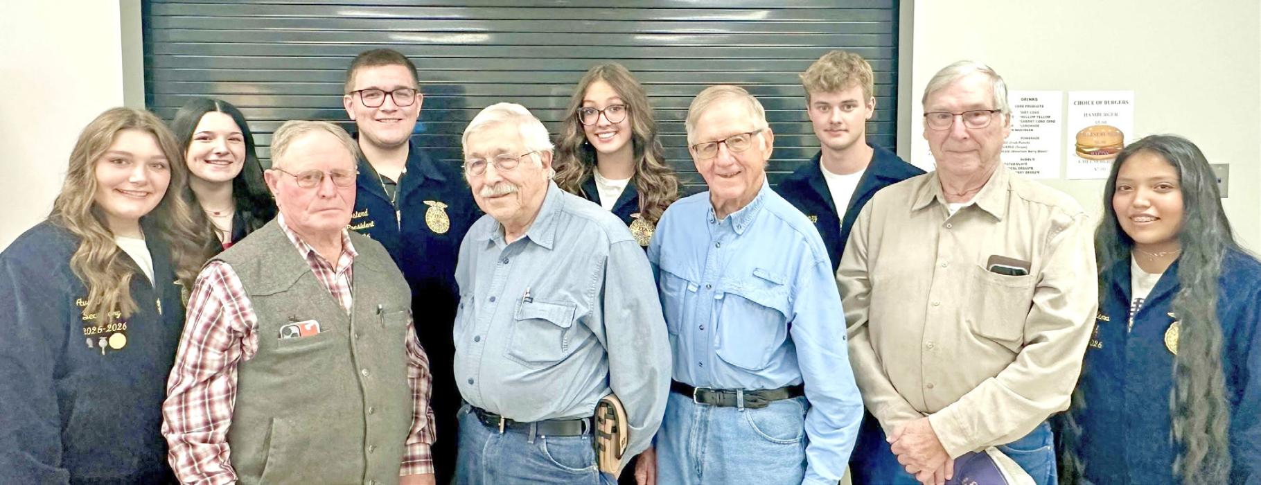 Gregory County FFA officers Secretary Ava Kerner, Reporter Daytona Paris, Vice President Leo Mostard, President Aubree Miller, Treasurer Tyler Kenzy, and Reporter Ellie Talsma, are shown l to r behind South Central Wind Association board members Richard Rubel, Dwaine Umberger, Don Stukel, and Louie Kehn, l to r, as the board closed out its balance and presented the balance to the FFA chapter. Not pictured are Ron Hartog and AJ Steffen, also members of the wind energy board. (Submitted photo)
