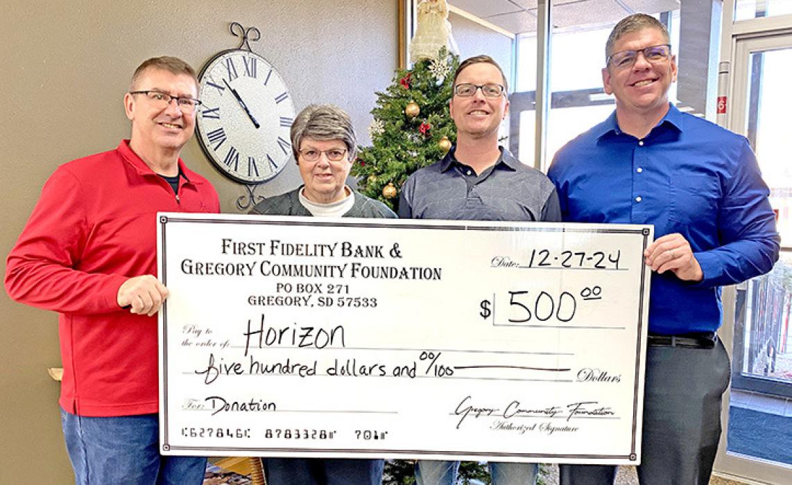 Sam Flakus, far left, and Tony Timanus, far right, representing First Fidelity Bank and Gregory Community Foundation, presented a grant check Bev Rubel, center left, and Hank Wonnenberg, center right, of the Horizon group.