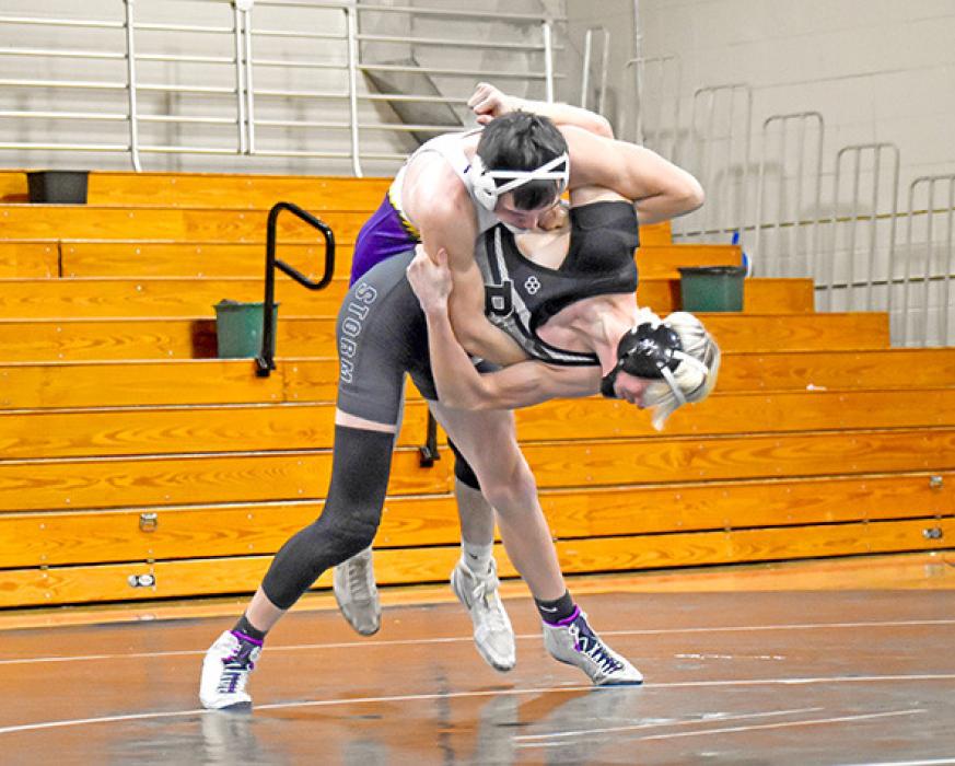 Avery Sengelmann throws Bennett County’s Talon Krolikowski for a take down. He pinned Krolikowski in only 42 seconds to win the match. (Photo by Kamre Peabody)