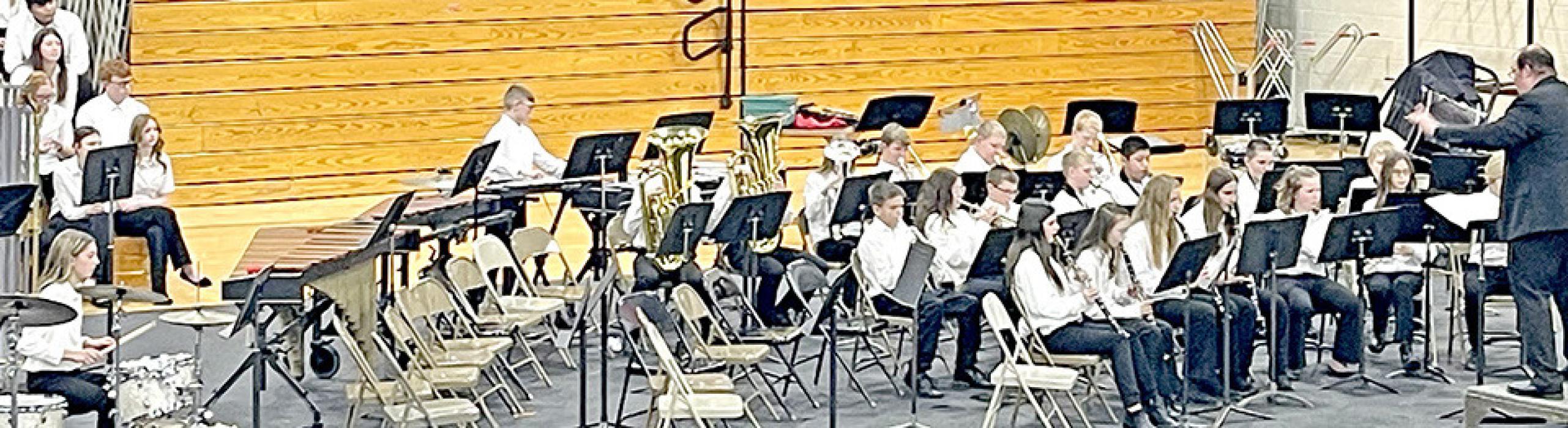 Small in number but big in talent, the 6th grade band entertained the crowd with a couple well-known tunes, All I Want for Christmas Is My Two Front Teeth and Do You Hear What I Hear. (Photo by Sara Anderson)
