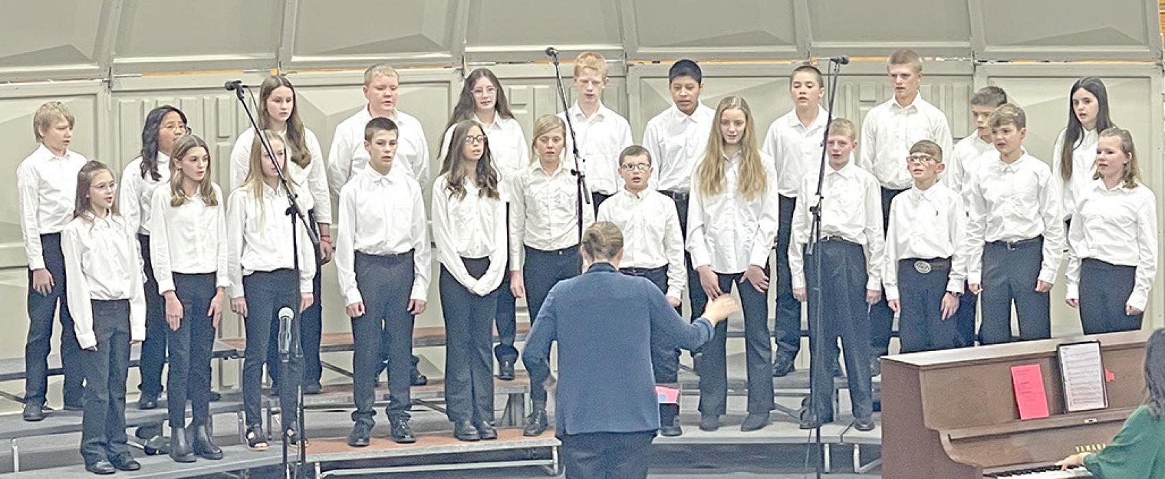 The 6th grade choir opened the program with two selections: Santa’s Coming and In December. (Photo by Sara Anderson)