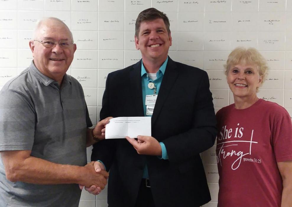 Ron Kyburz, left, and Anita Messerschmidt, right, representing the Gregory Community Foundation, present a check for $15,000 to Hospital Administrator Tony Timanus. The check completes the Foundation’s total pledge of $25,000.