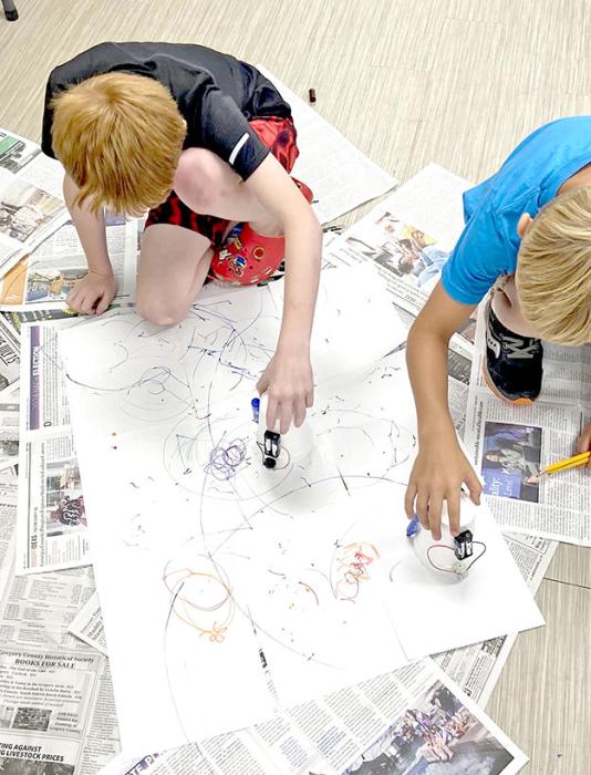 On Tuesday, July 16, Gregory County 4-H put on a Junk Drawer Robotics workshop where youth worked with circuits and gears. Youth used battery powered circuits to power small motors to make plastic cups spin and draw on paper and used the small motors to create their own fun cup robots that battled each other. Youth also made gear chains that moved different pieces. This workshop taught youth problem solving skills and cause and effect when using electricity.