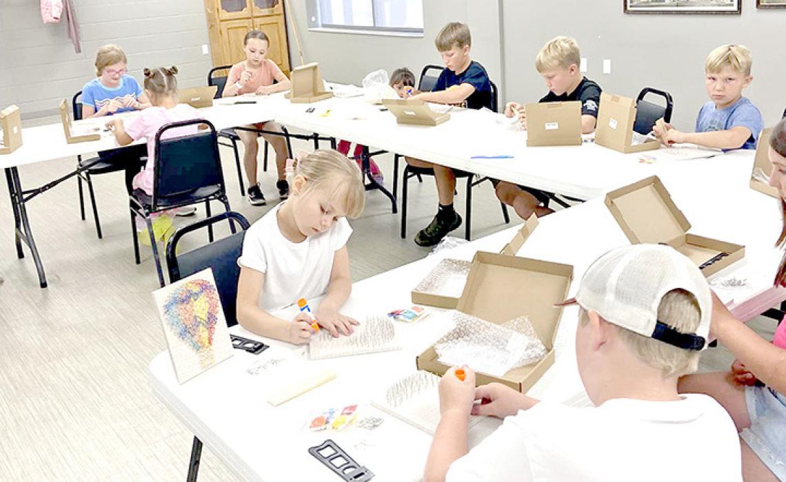 Gregory County 4-H held a String Art workshop for youth on July 8th. Attendees planned the color pattern of their strings by coloring and visualizing what their ideas would look like. They then nailed a hot air balloon pattern on each of their boards, then used a wide variety of colored string to make their creation. By weaving the strings through the nails, they were able to make different and unique patterns and patches in their hot air balloons.