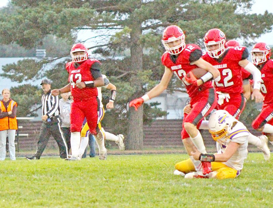 Colt Keiser, #12, works to free himself from a Cavalier defender in Friday night’s win. (Photo by Kristy Ring)