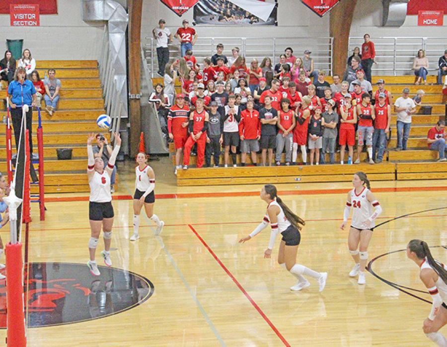 Attackers approach the net in unison, with support from Gregory students. (Photo by Kristy Ring)
