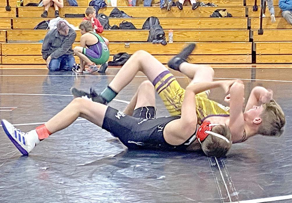The middle school wrestlers hosted a tournament on Friday. Otto Reber, shown here, battled Kade Fenenga of Winner and won by a tech fall 15-0.