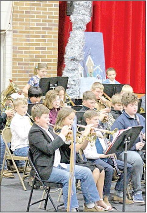 The brass section of the fifth grade band showed how far they’ve come in a few short months with a skillful performance of a couple holiday tunes.
