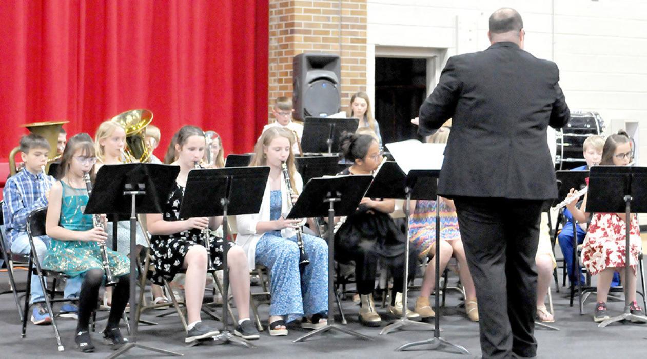 Band Instructor Jared Opp conducts the fifth grade band as they kick off the elementary spring concert with “The World’s Greatest Show,” a three-part arrangement by William Owens.