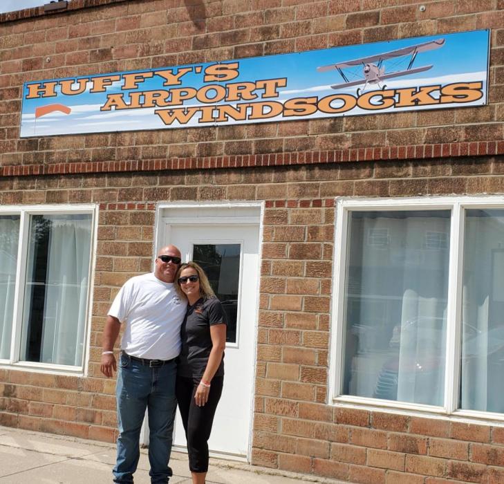 Mike and Jacky Hoffman, shown here outside their downtown Spencer building, are the owners of Huffy’s Airport Windsocks.