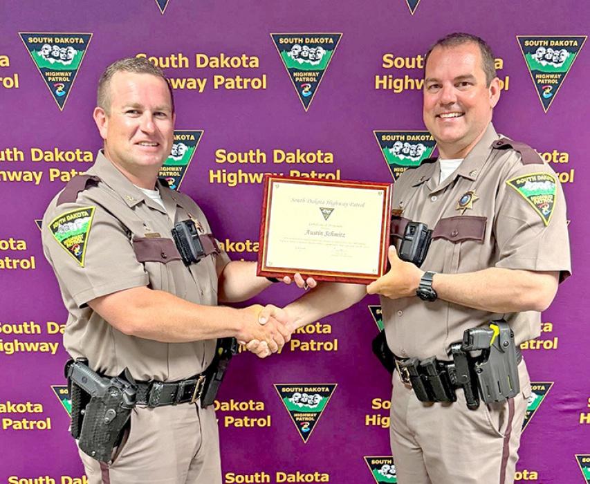 The South Dakota Highway Patrol has announced the appointment of Major Austin Schmitz (r) as its new Assistant Superintendent. Schmitz will now oversee the agency’s administrative operations. Major Schmitz brings 16 years of experience within the Highway Patrol to his new role. His tenure includes service as a police service dog handler and leadership in key operations. He has also been recognized for bravery, including an Act of Valor Award in 2020 for a rescue on Lake Sharpe.