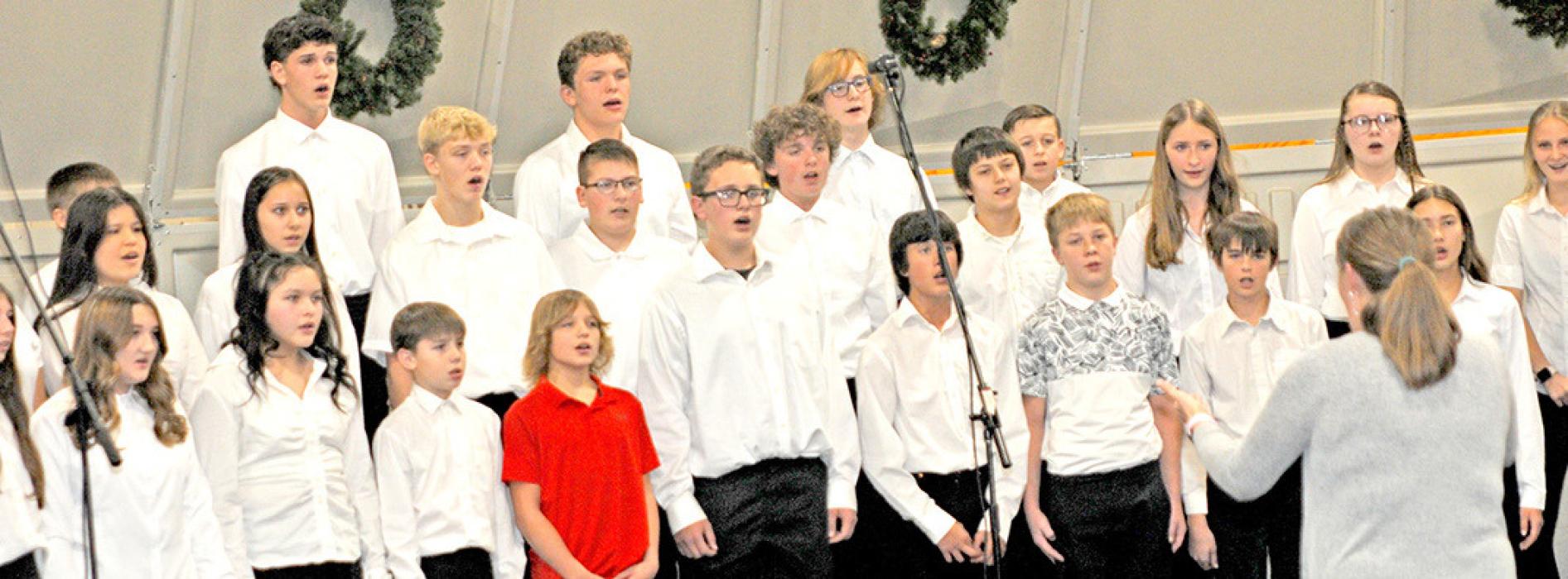 The junior high choir performed three songs, and even included some students on percussion for one.
