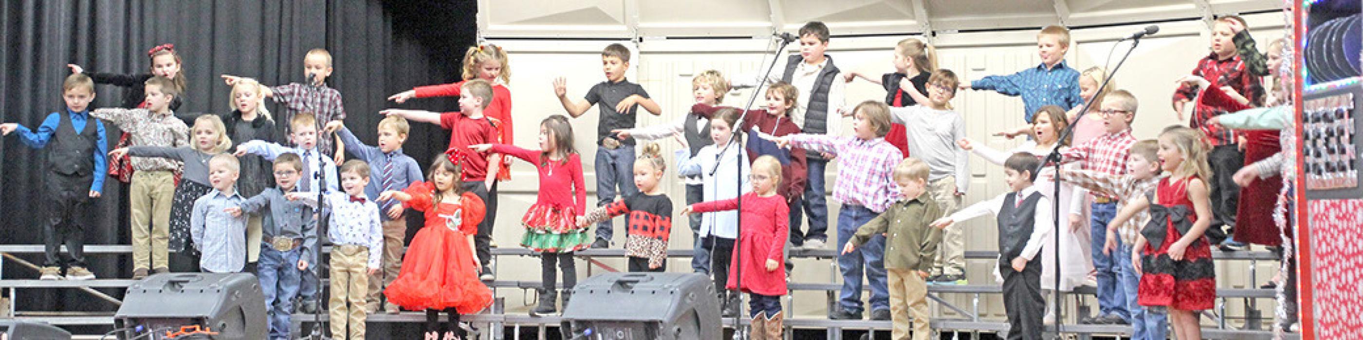 The Gregory Elementary School holiday concert was held Monday evening at Gregory Memorial Auditorium. The mood was festive as the children performed a variety of holiday songs, from Jingle Bells by the 5th grade band to Deck the Halls, You’re A Mean One, Mr. Grinch, and Sleigh Ride by the different choirs.