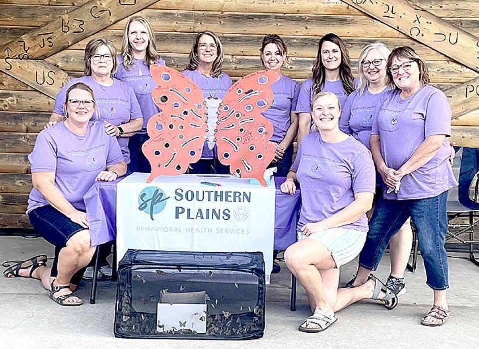 The staff from Southern Plains Behavioral Health Services include, l to r: Liz VanOverschelde, Penny Heenan, Emilie Myrmoe, Amy Walker, Amy Davis, Brittany Atteberry, Rhonda Gilchrist, Debbie Storms, and Lindsey Mc-Carthy (kneeling in front). (Photo by Penny Heenan)