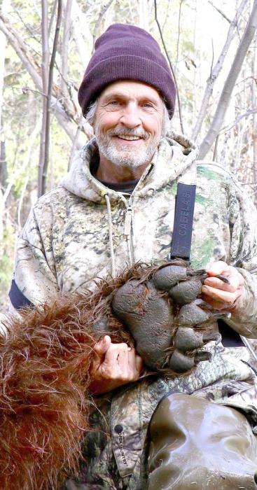 The grizzly’s paw was almost the size of Chris’s face.