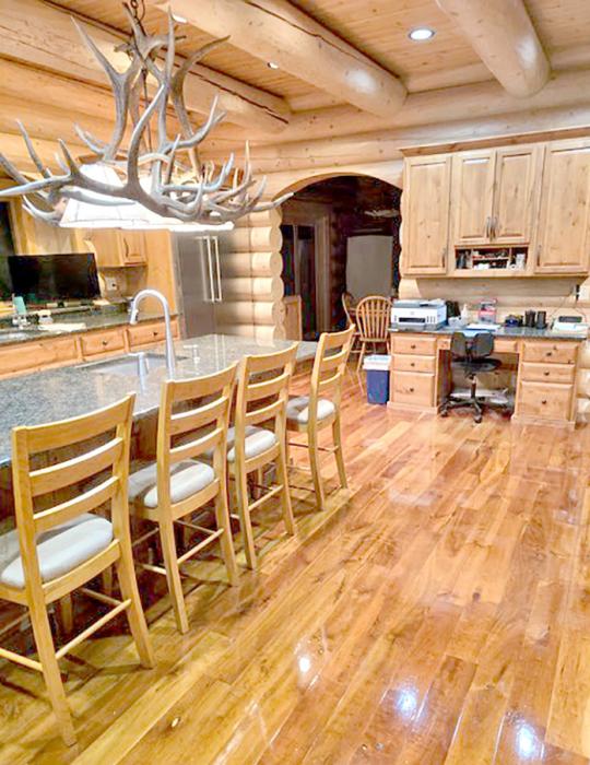 The kitchen in the main part of the lodge is outfitted with professional-grade appliances, a water purifier, coffee bar, and a beverage refrigerator in the breakfast room.