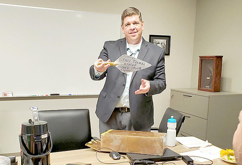 The first item Hospital and Nursing Home Administrator Tony Timanus removed from the sealed copper box found at the nursing home was a trowel. It had been used by Mrs. Martha Faust to lay the cornerstone.