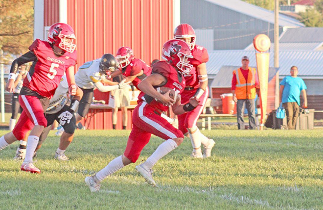 Dane Johnson gets some good blocks as he advances the ball. (Photo by Maya Hull) by Coach John King
