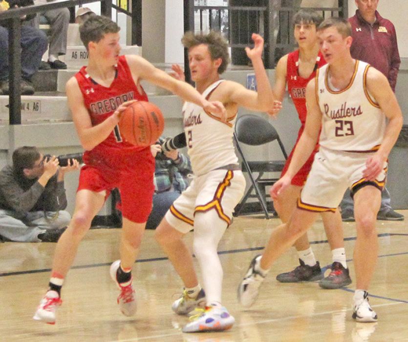 Cruz Klundt makes his way around a Rustler defender in the SoDak 16 game against Ethan. (Photo by Gracie Stephens)