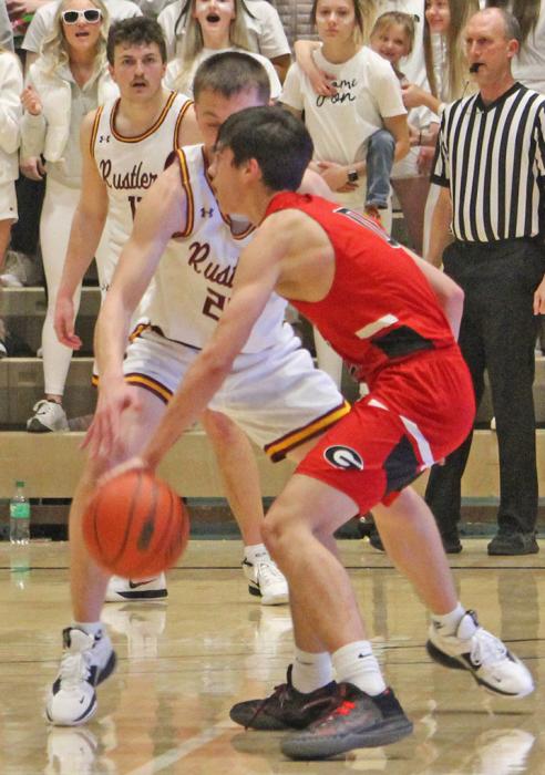 Noah Bearshield zoned in on the basket to score seven points against the Rustlers. (Photo by Gracie Stephens)