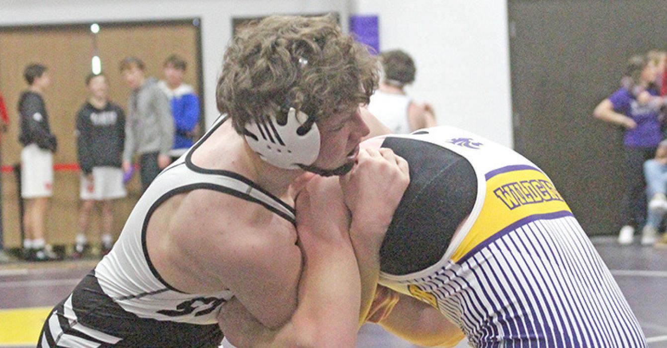 Kaleb Schonebaum holds his own against opponents who far outweigh him. (Photo by Dan Bechtold, Winner Advocate)