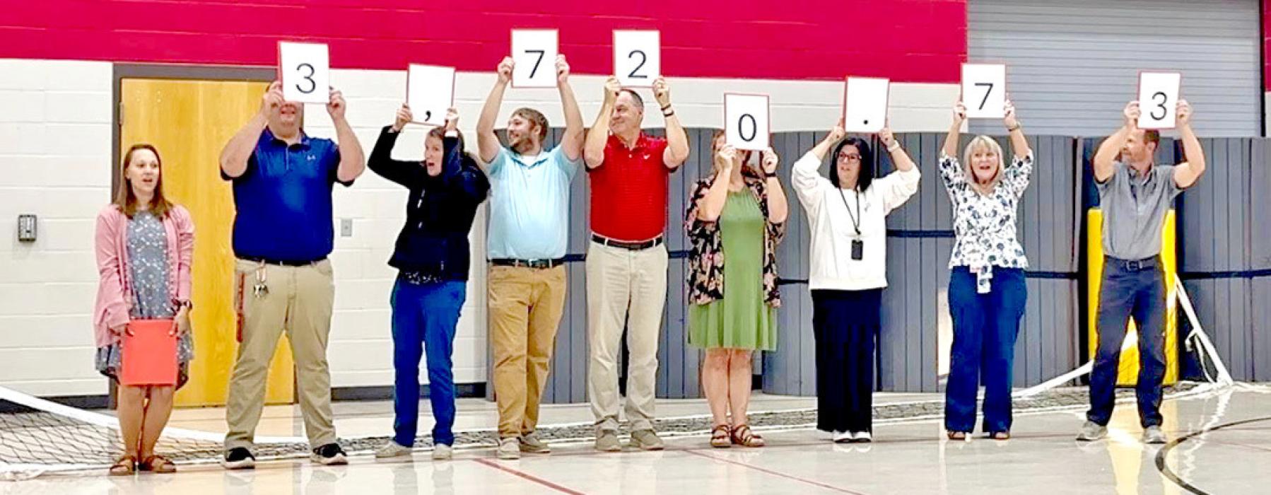 The money raised by the school was revealed one number at a time, starting with the lowest to build suspense, during Gorilla Gatherings Monday morning, October 3, 2025. (Photos by Sara Anderson)