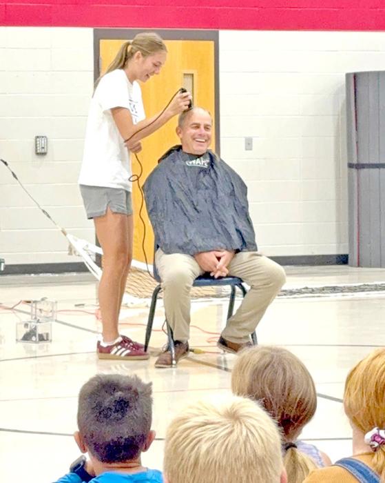 Mr. Murray was in good humor as his niece shaved his head.