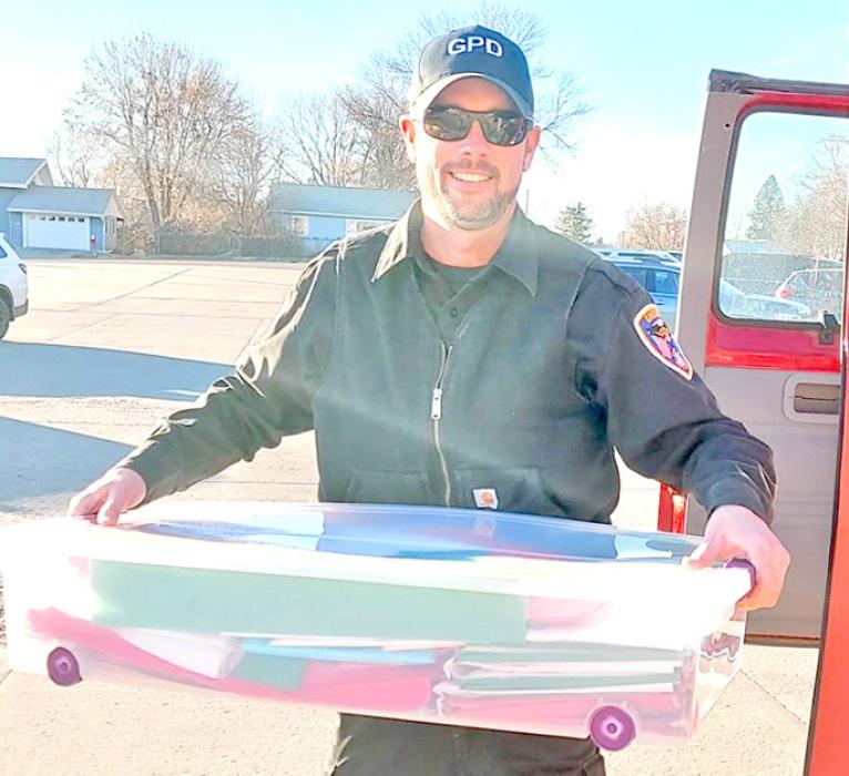 This year, Santa needed some extra help, so he recruited the younger classes as official reindeer helpers. Giggling, with smiles on their faces, students chose a gift for someone they love. Even the local police chief, Ryan Cook, stepped in to help make the day a very special one.