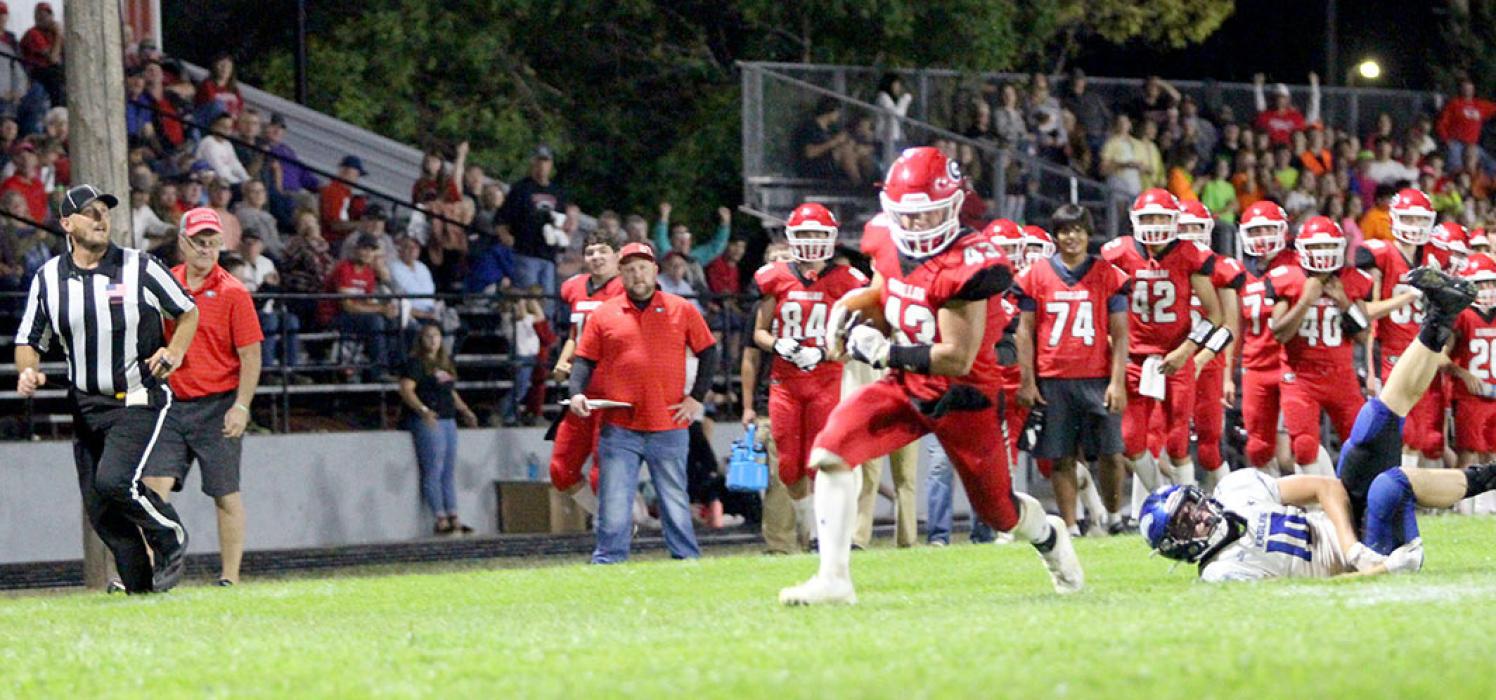 Trey Murray breaks a tackle on his way to the goal line in Friday night’s win over Irene/Wakonda. Murray scored 14 points for the Gorillas in the game. (Photo by Alexis Kortan)