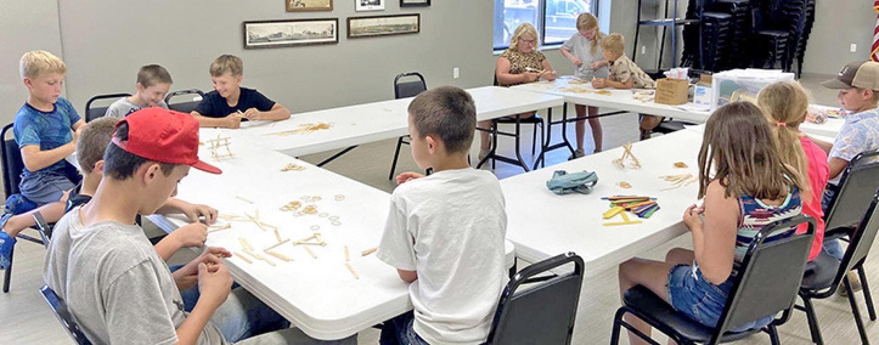 On Thursday, June 29th, Gregory County 4-Her’s put their brains to the test to create their own working catapults at Junk Drawer Robotics Workshop. Youth learned about the engineering design process and tested different catapults with different objects to find the best launching craft. Youth used only rubber bands and popsicle sticks to make different catapults and were able to innovate them by using their own imagination.