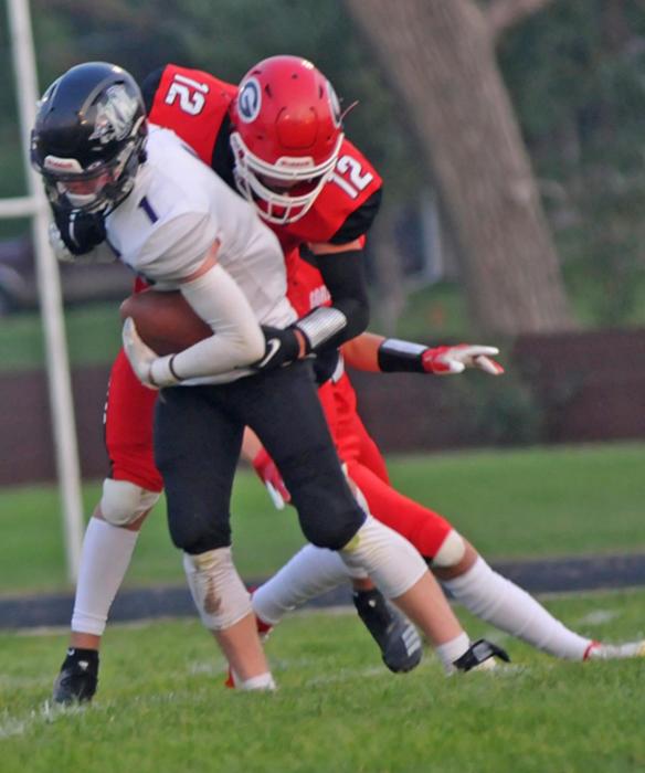 Eli Fogel stops a Kimball/White player as Gregory held their opponent to only six points in the win.